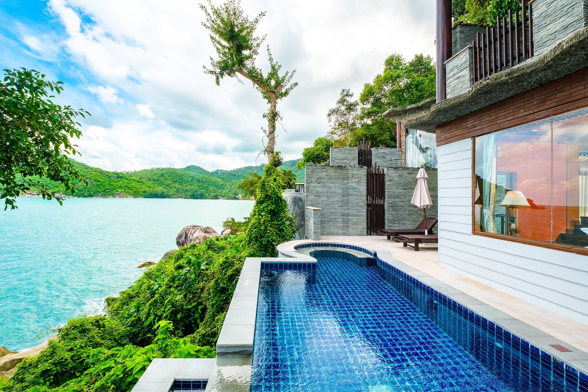 Detached villa at Panviman Resort Koh Phangan — private luxury villa surrounded by tropical gardens, offering ocean views and peaceful island ambiance.