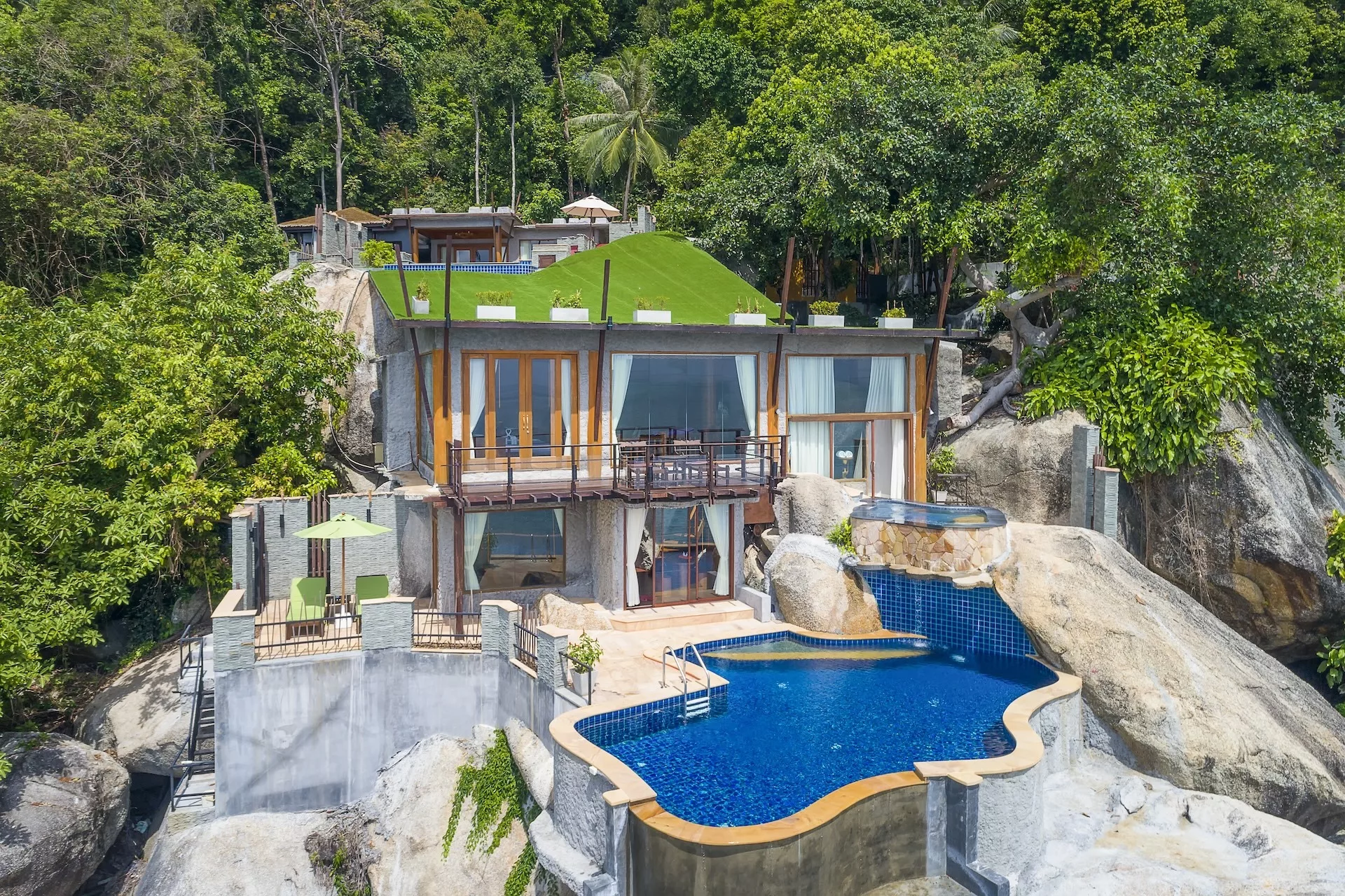 Panoramic ocean view at Panviman Resort Koh Phangan — breathtaking wide-angle sea view of turquoise waters and lush tropical hills from the resort’s hillside villas.